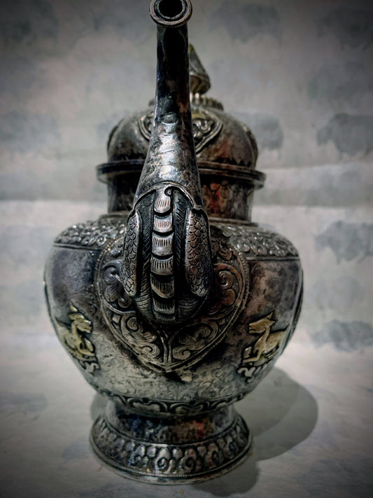 An antique silver and gilt ceremonial Tibetan teapot