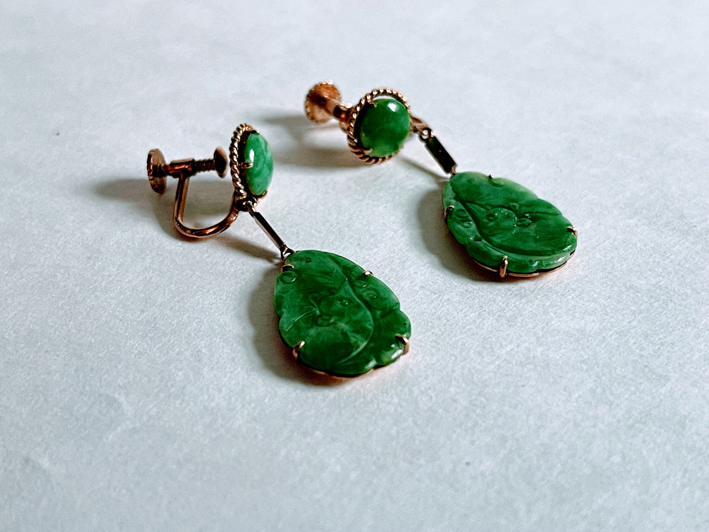 A pair of vintage apple green jadeite  dangling earrings in a 14kt setting