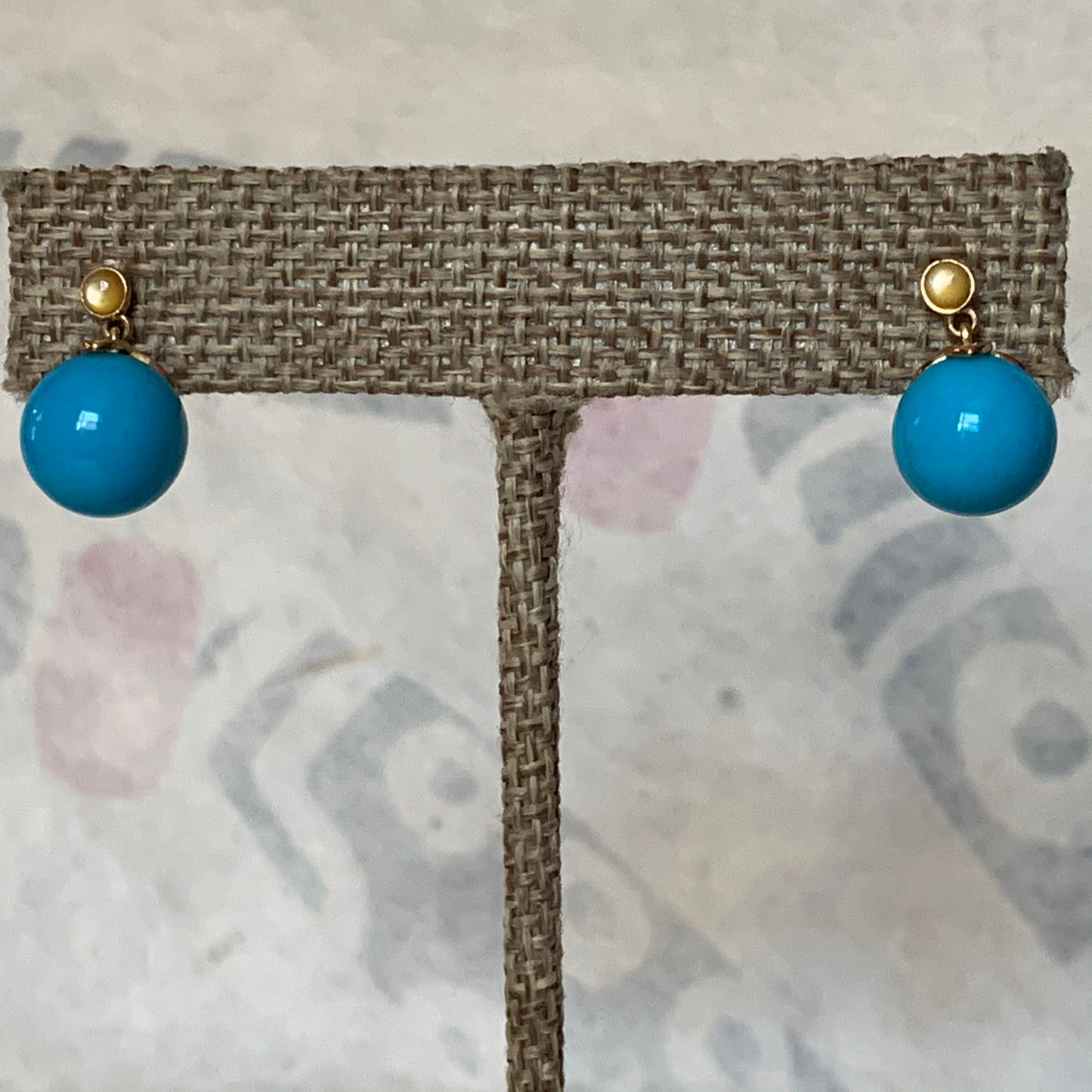 A pair of turquoise earrings