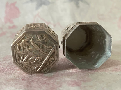 An antique octagonal shaped silver box with lid from south east Asia.