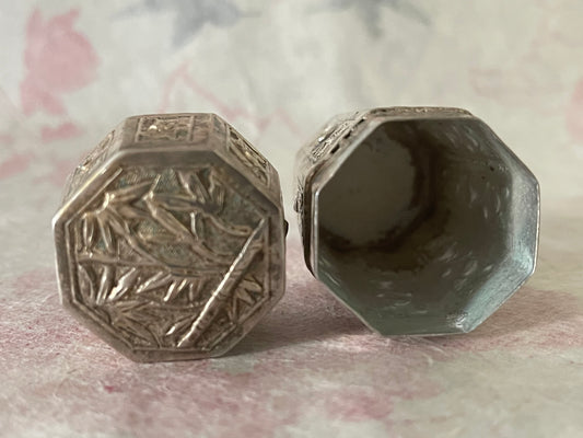 An antique octagonal shaped silver box with lid from south east Asia.