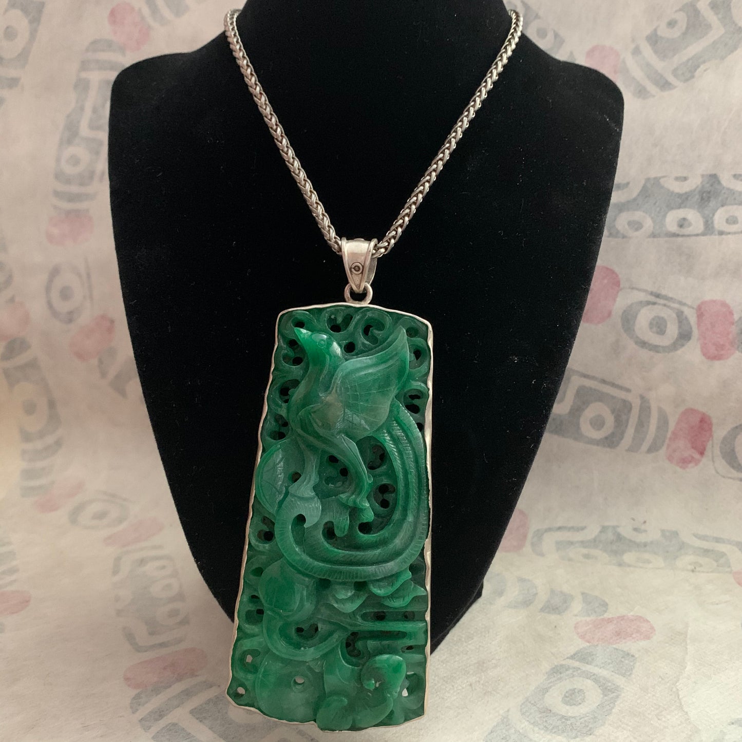 A jade and silver pendant