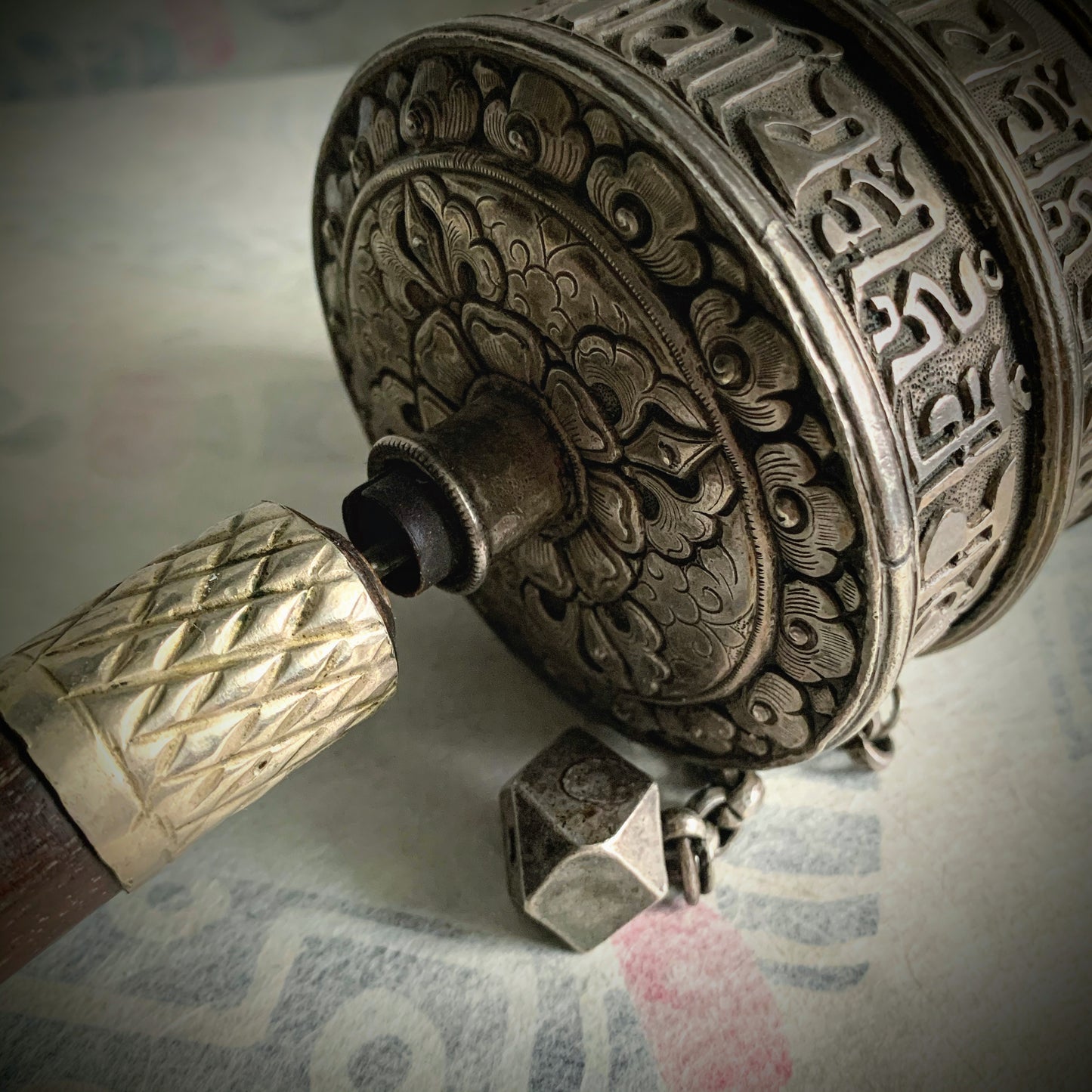 An antique Tibetan handheld prayer wheel