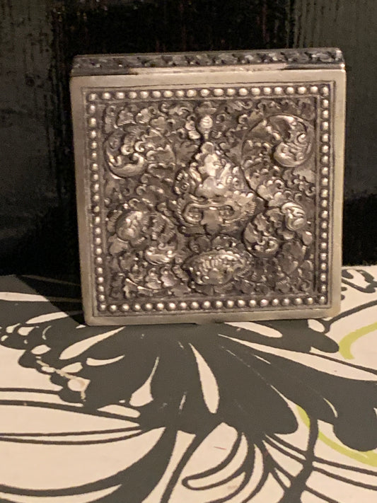 A silver compact box