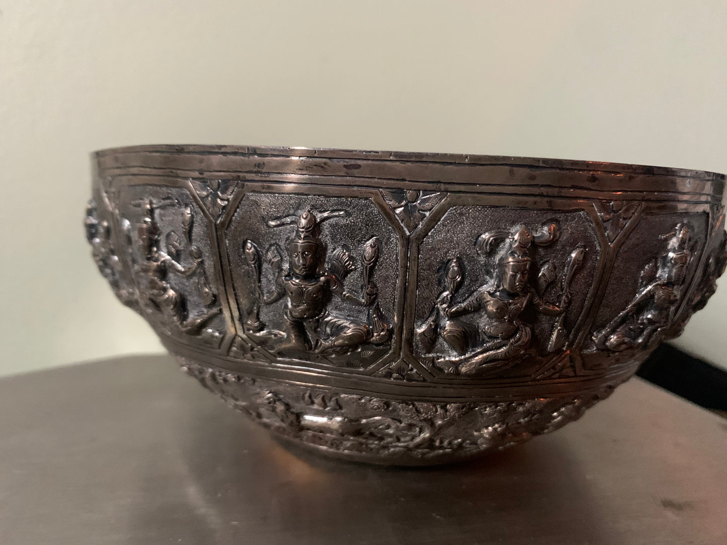A silver repousse bowl