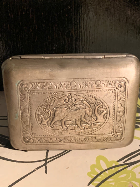 A silver box with hinged lid