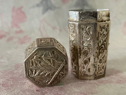 An antique octagonal shaped silver box with lid from south east Asia.