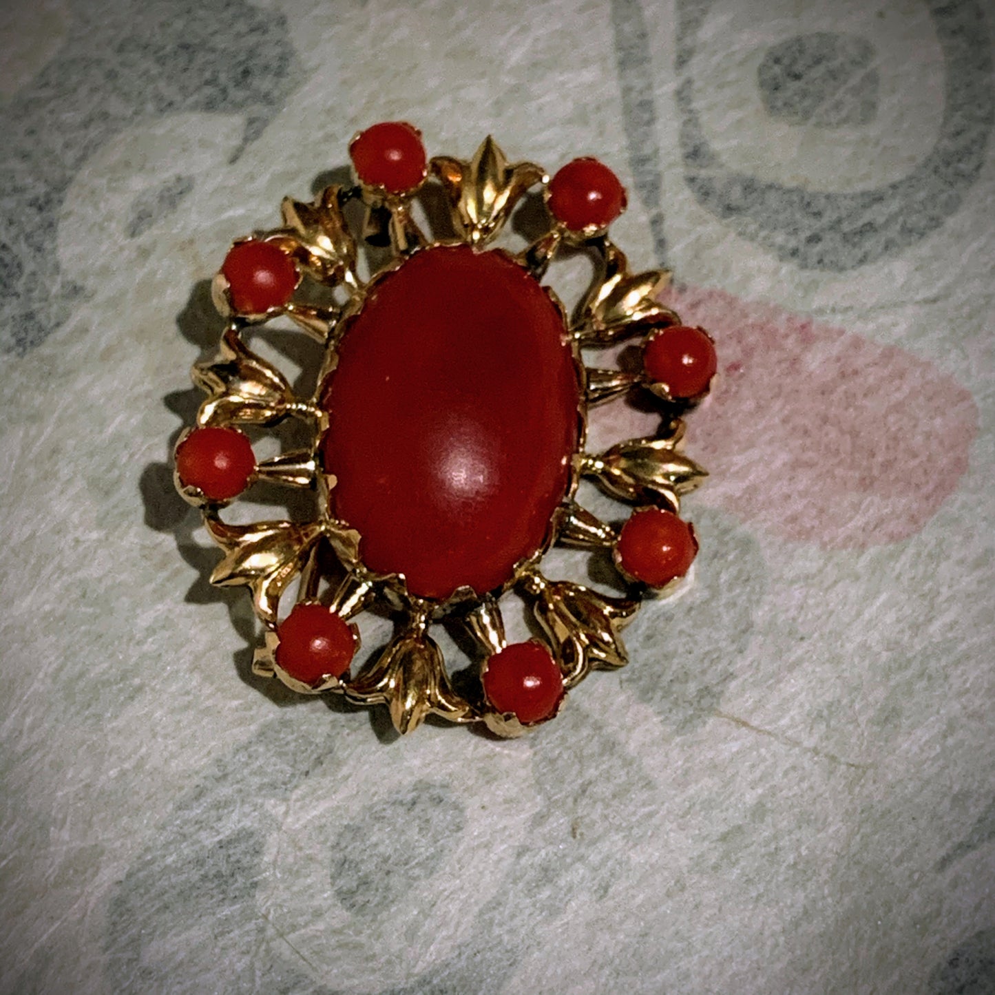 A vintage red coral brooch in 18kt setting