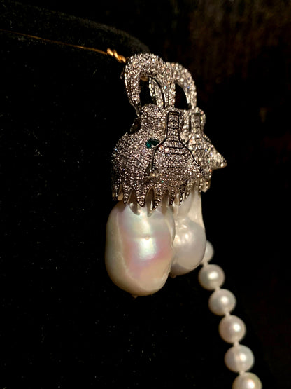A Panther ear ring and necklace