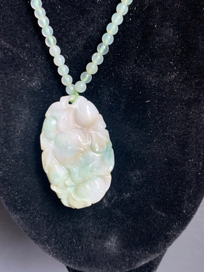 A jade necklace and pendant