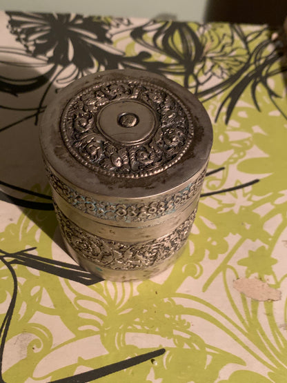A cylindrical metal box