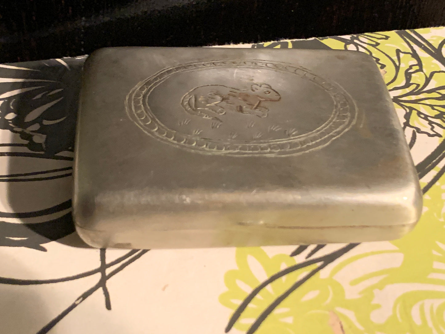 A silver box with hinged lid