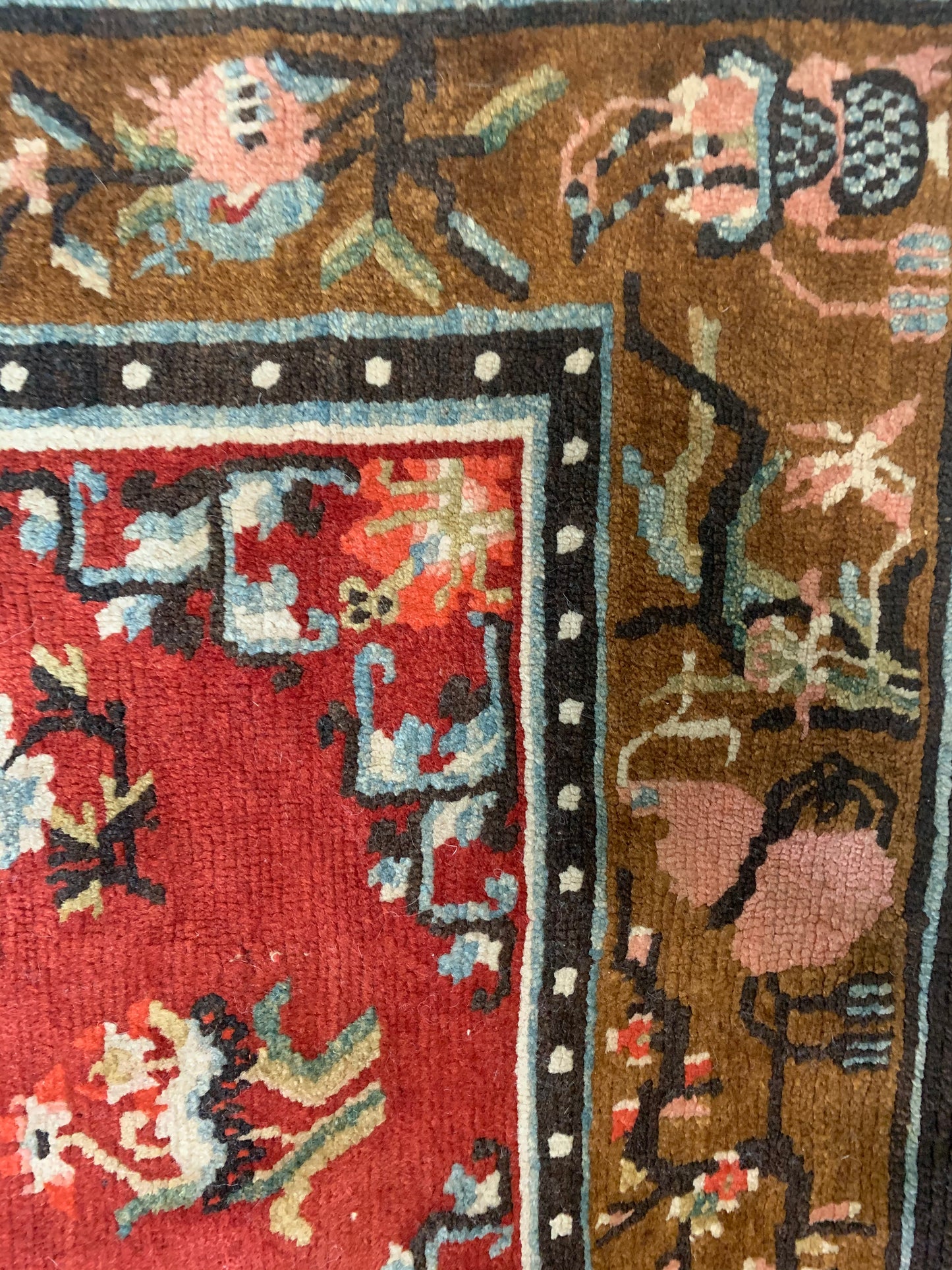 An antique Tibetan wool rug