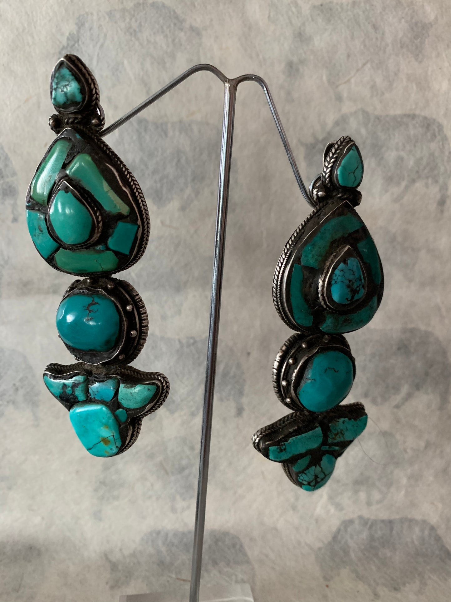 A pair of antique Tibetan turquoise and silver ear pendants / earrings