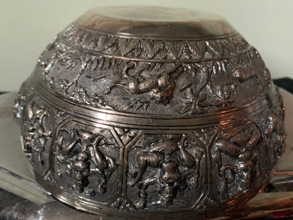 A silver repousse bowl