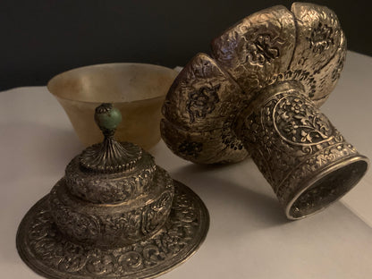 A silver Tibetan cup stand
