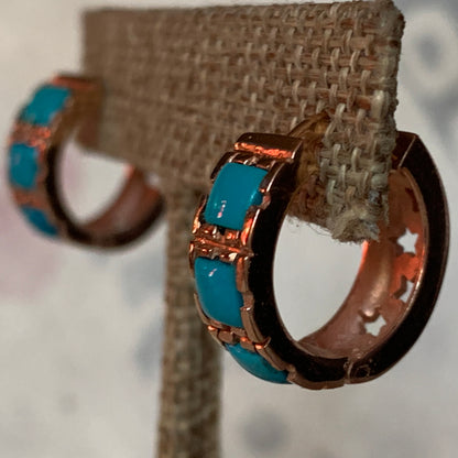 A pair of turquoise hoop earrings