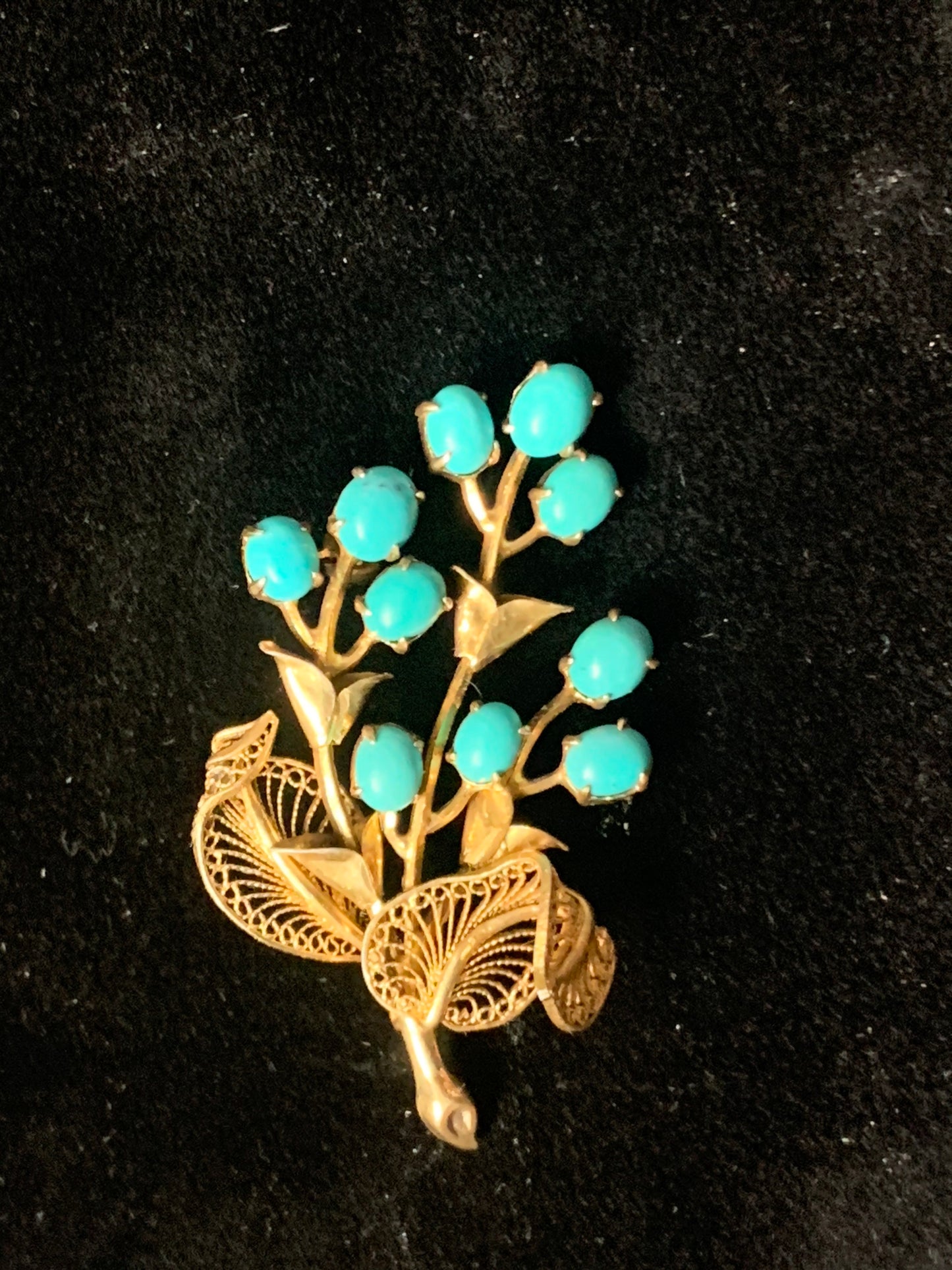 A turquoise brooch