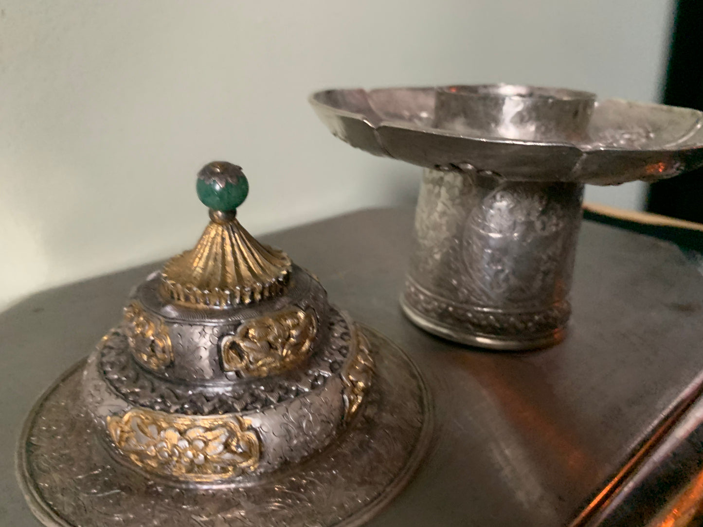A silver cup stand