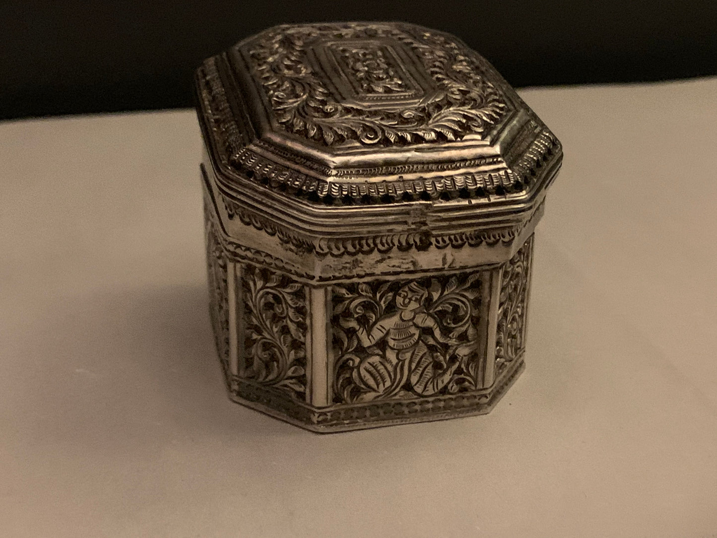 An octagonal silver box