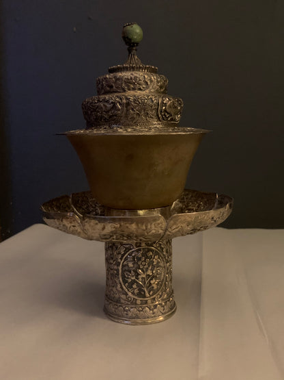 A silver Tibetan cup stand