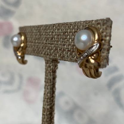 A pair of vintage pearl earrings