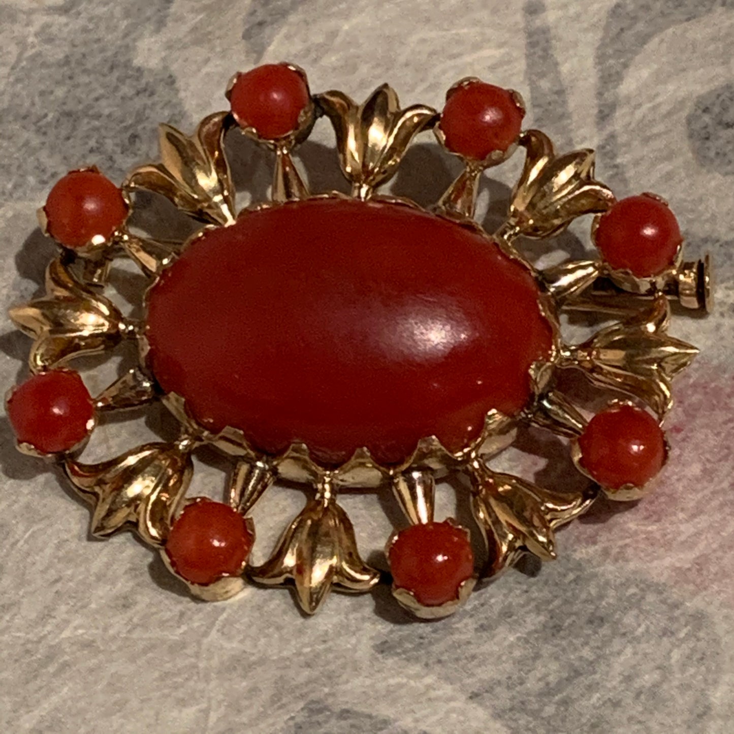 A vintage red coral brooch in 18kt setting