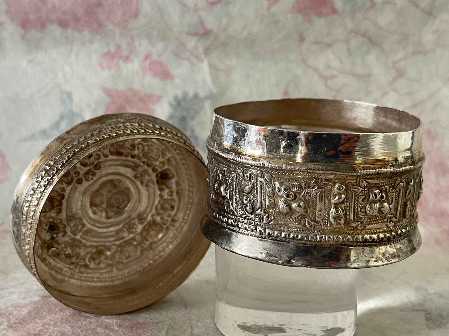 An antique silver south East Asian round box with lid