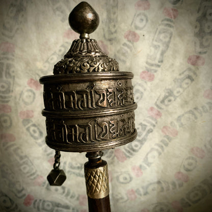 An antique Tibetan handheld prayer wheel