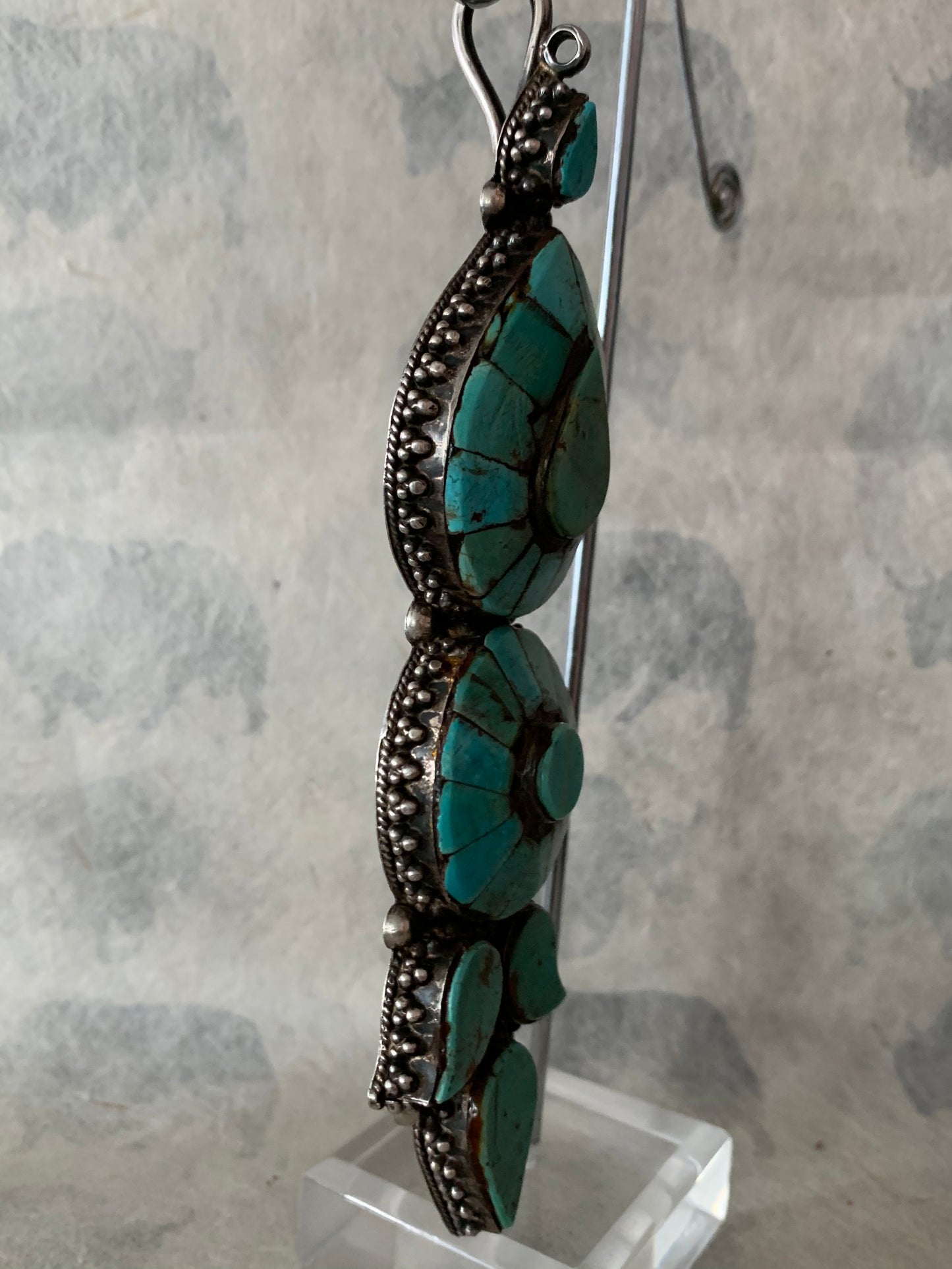 A single antique Tibetan turquoise and silver ear pendant/ earring