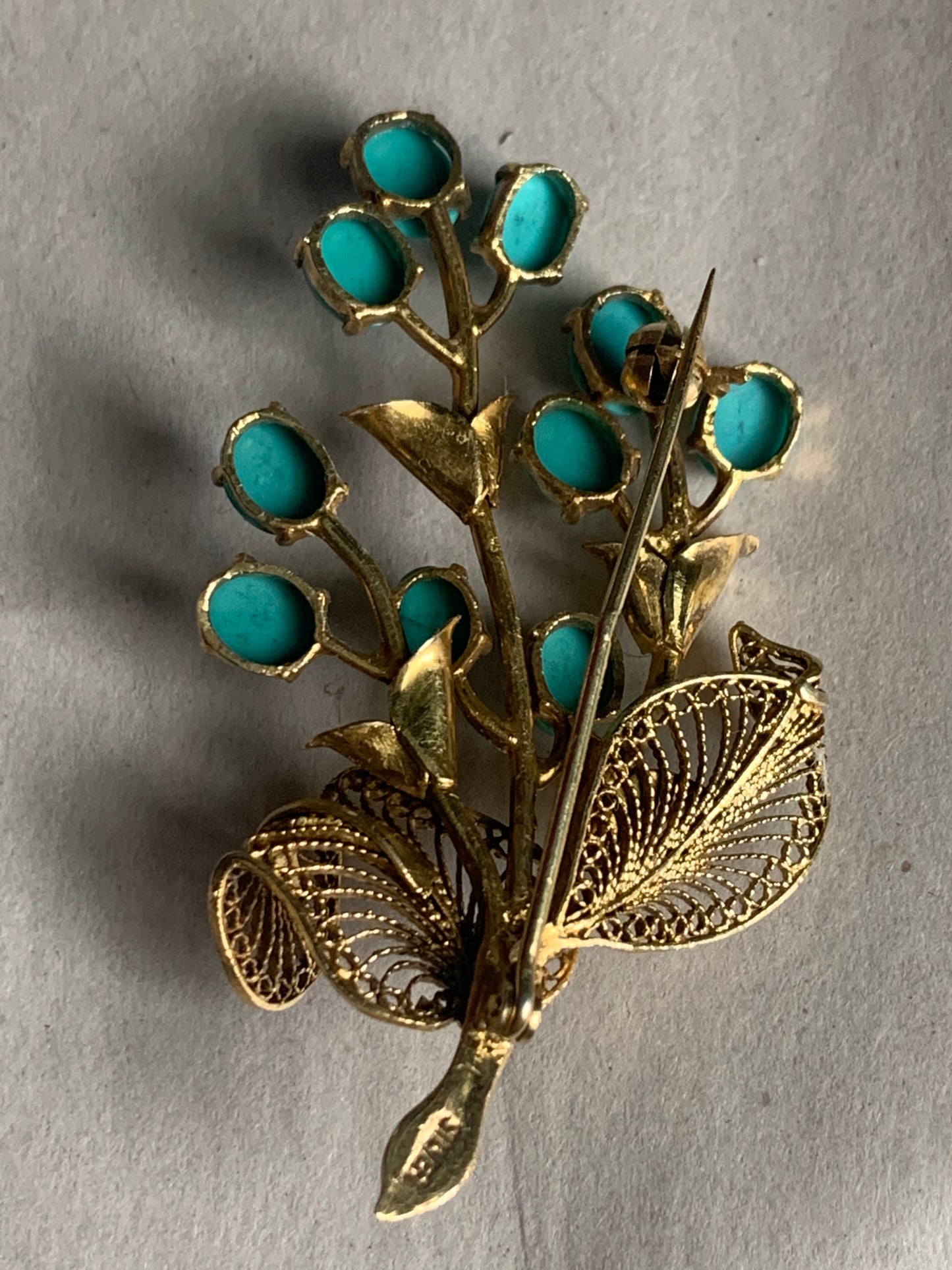 A turquoise brooch