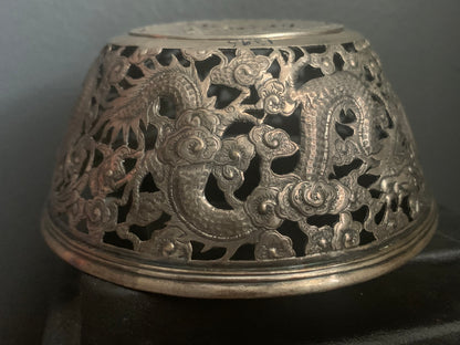 A silver bowl sleeve