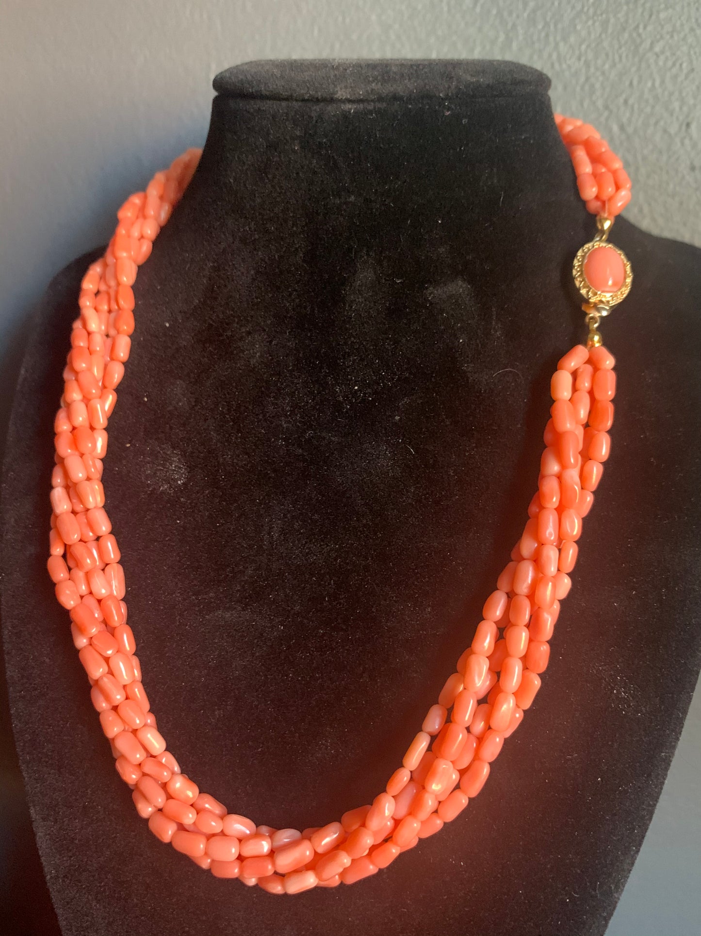 A multi-strand coral bead necklace