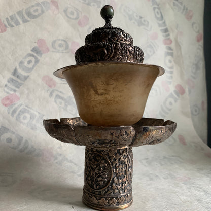 A silver Tibetan cup stand