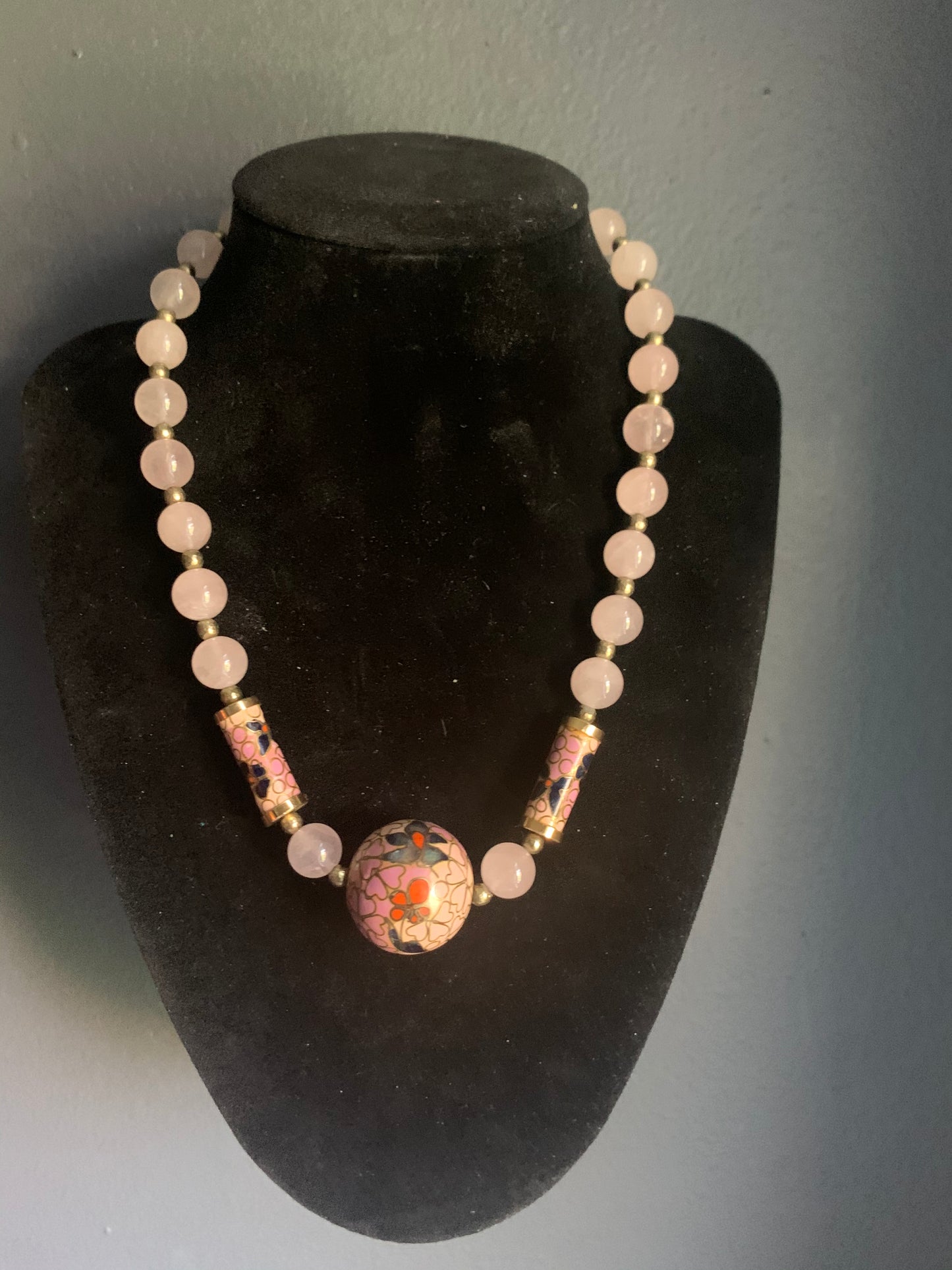 A necklace with rose quartz beads