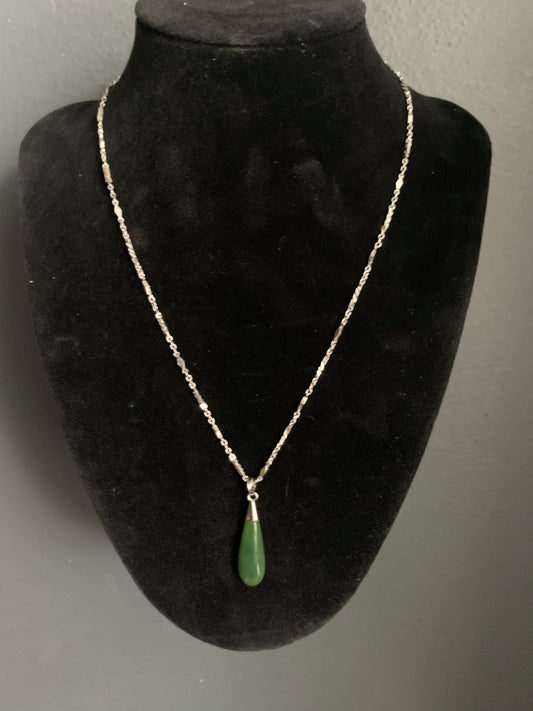 A jade tear drop ear ring and necklace in silver