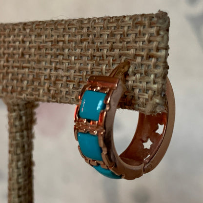 A pair of turquoise hoop earrings