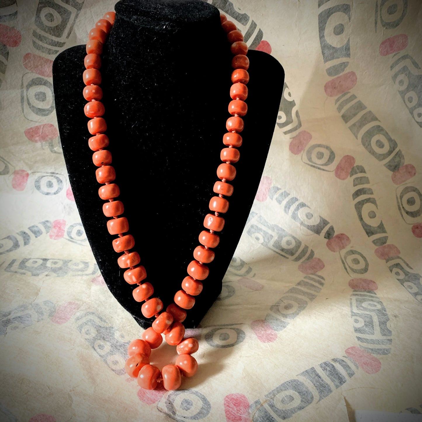 A salmon colored vintage coral bead necklace