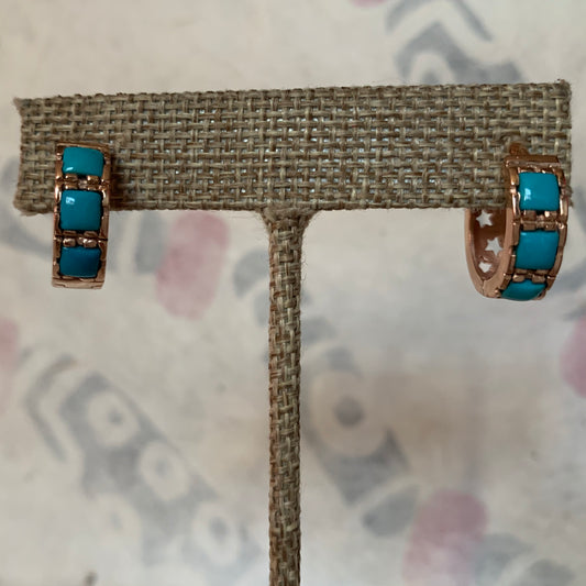 A pair of turquoise hoop earrings