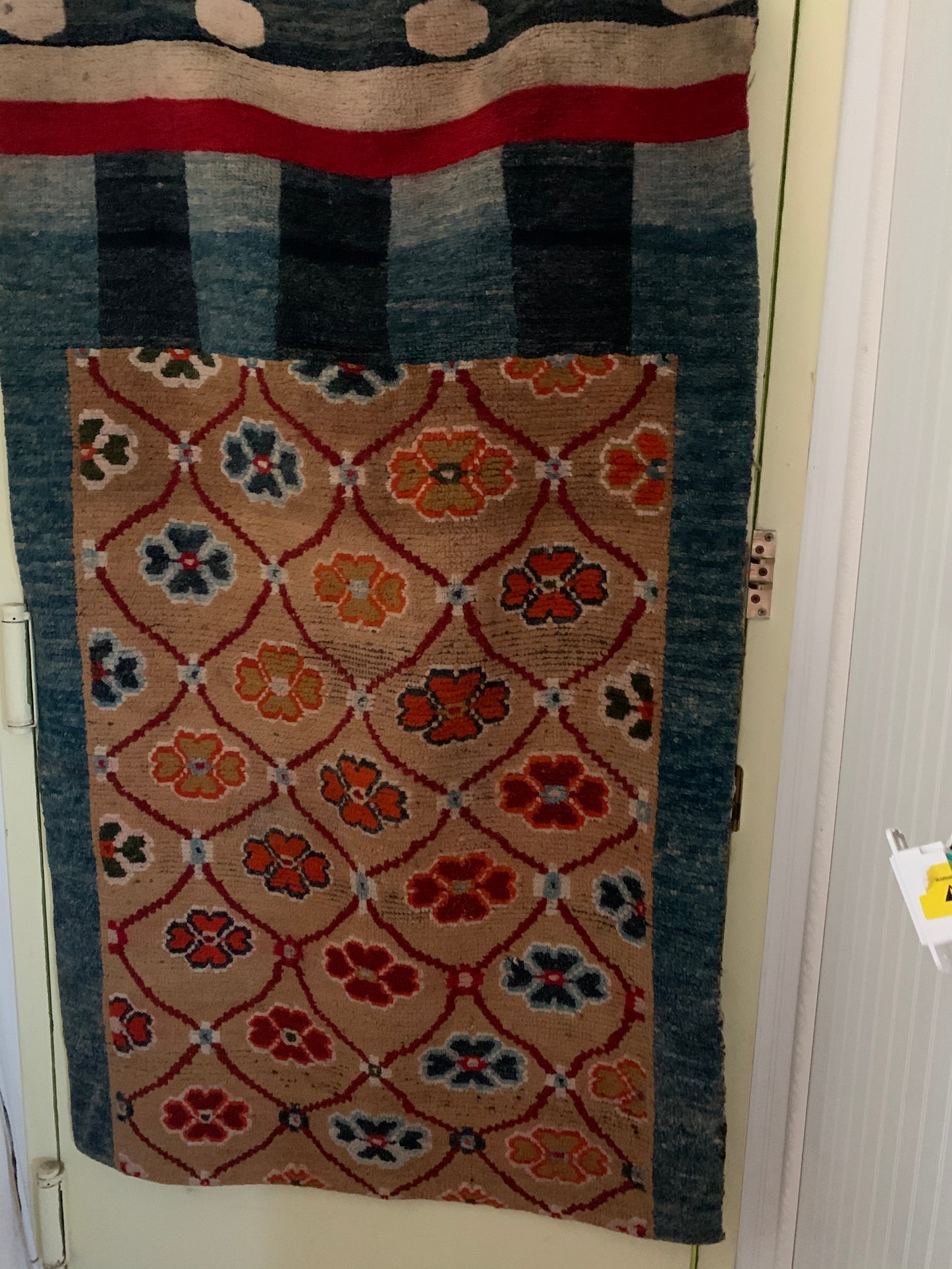 An antique Tibetan door curtain rug