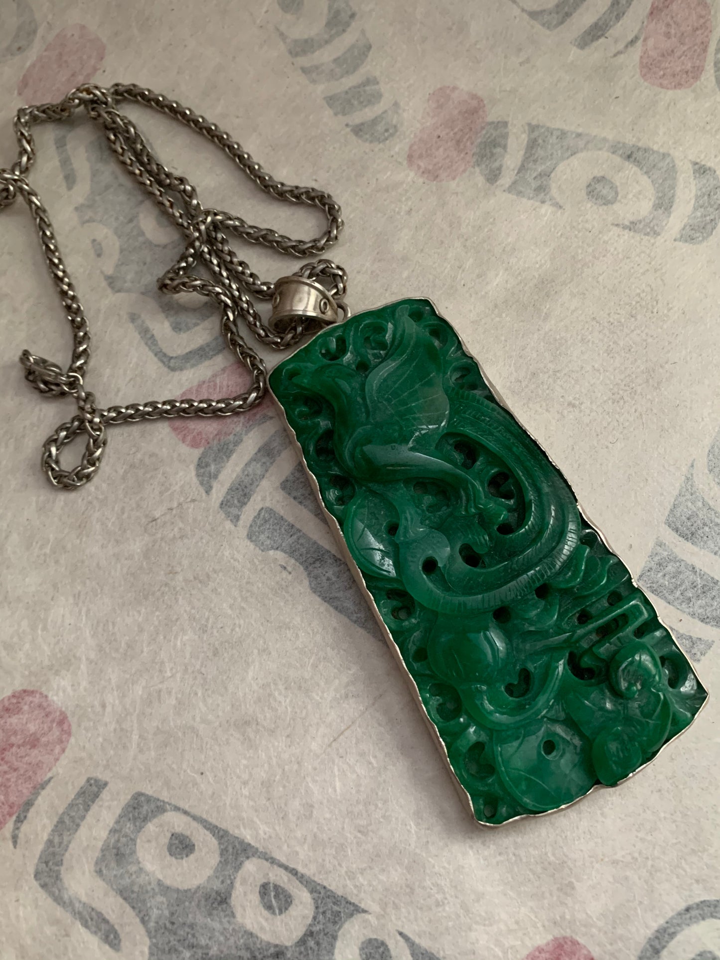 A jade and silver pendant