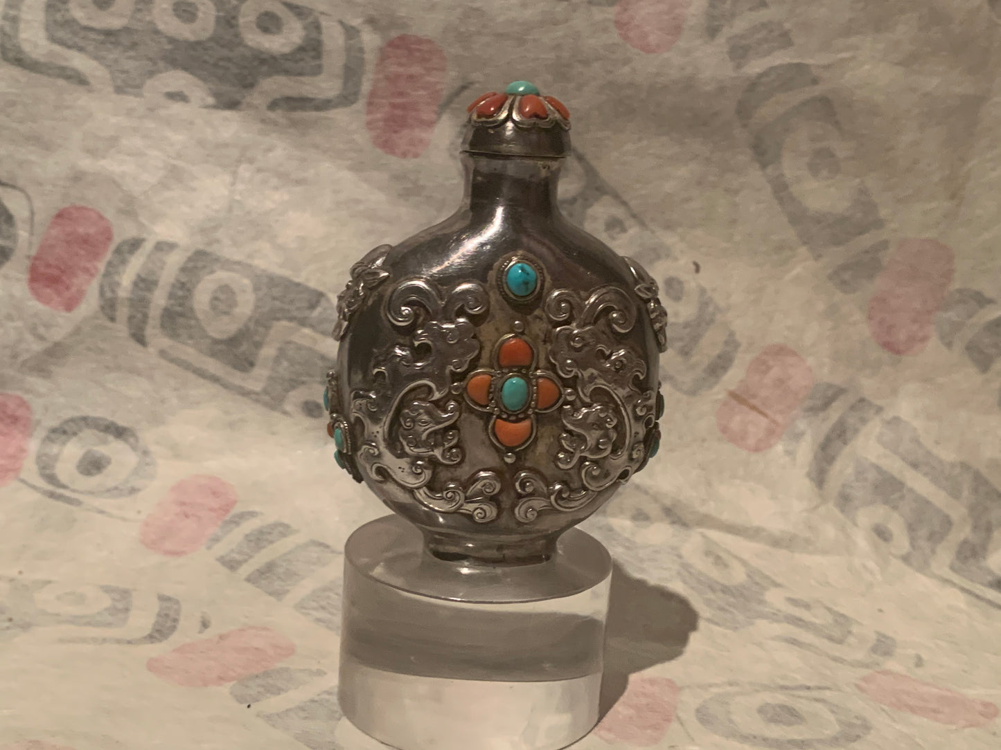 A Mongolian silver snuff bottle - with coral and turquoise