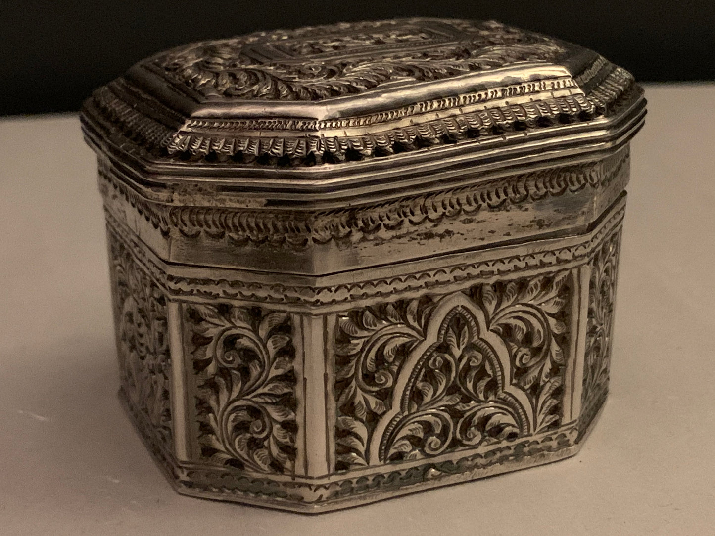 An octagonal silver box