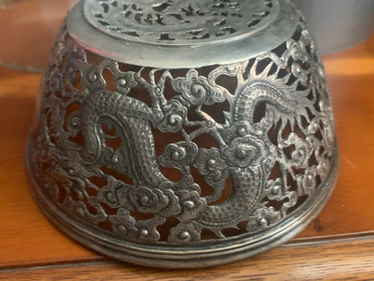 A silver bowl sleeve