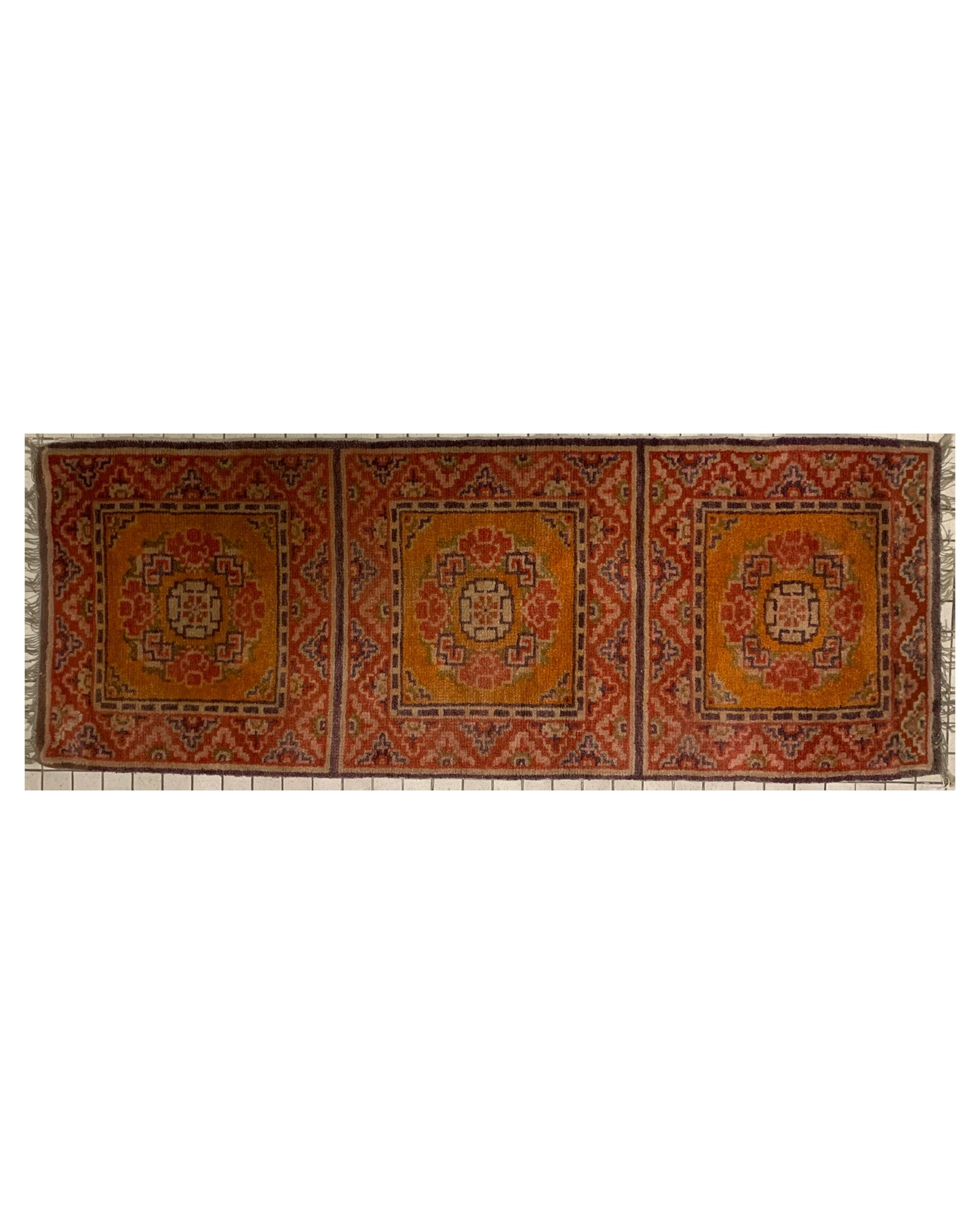 An antique triple seater Tibetan meditation rug