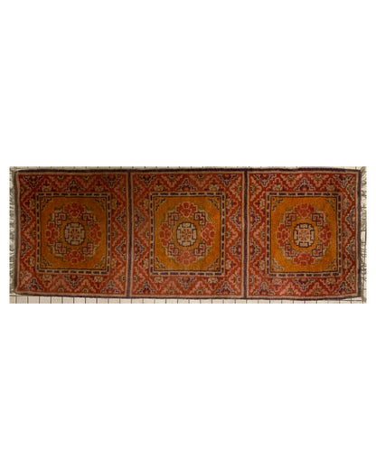 An antique triple seater Tibetan meditation rug