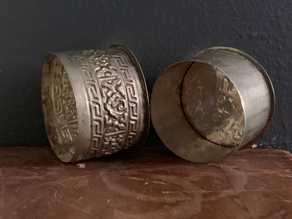 A cylindrical silver box