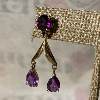 A pair of amethyst gold earrings