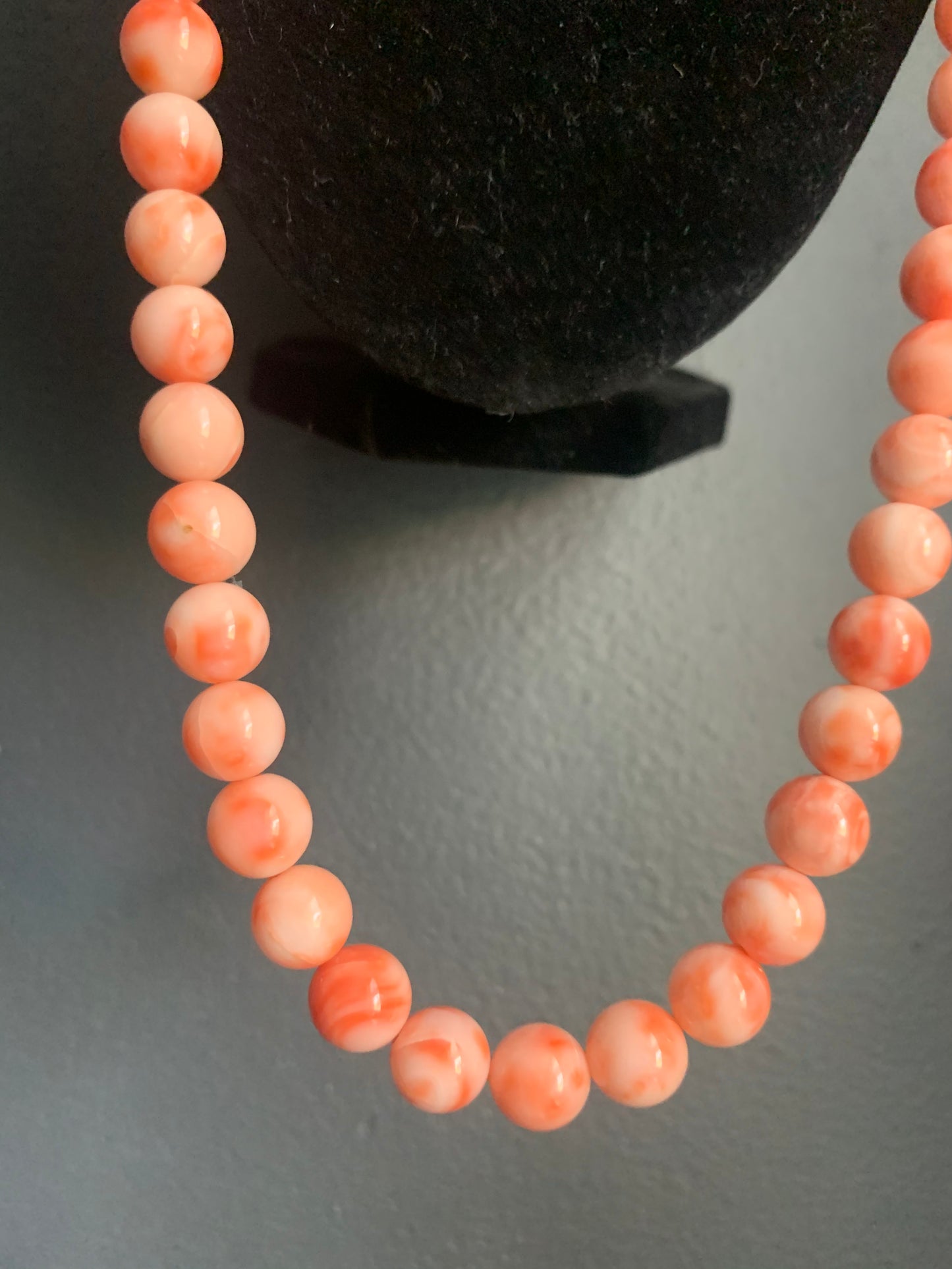 A salmon colored coral -like bead necklace