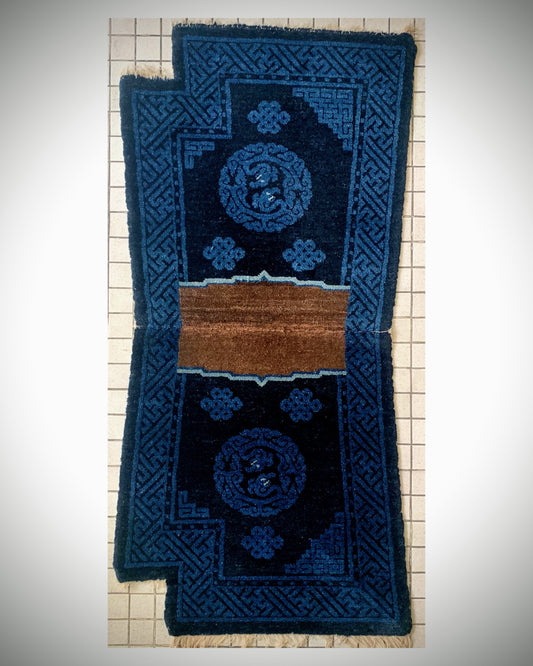 A vintage indigo saddle rug